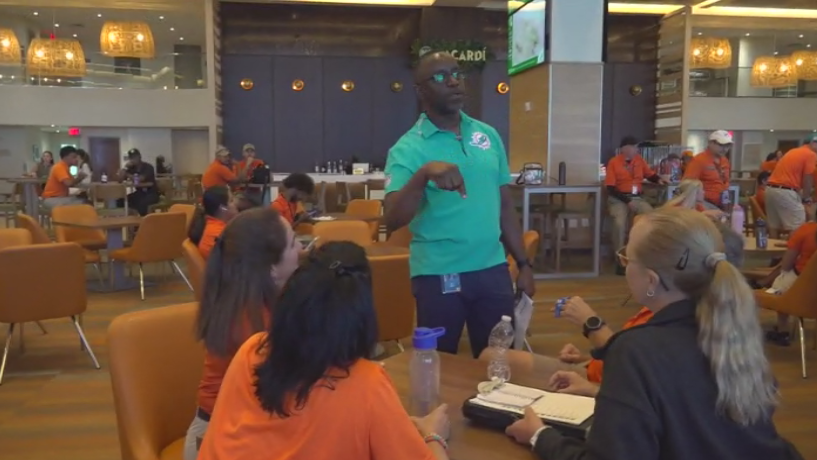 Miami Dade College professor finds his passion with side job at Hard Rock Stadium — CBS Miami, McKinney Arts news